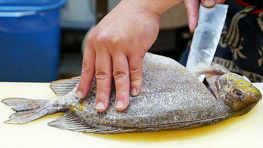 日本厨师处理鱼做生鱼片